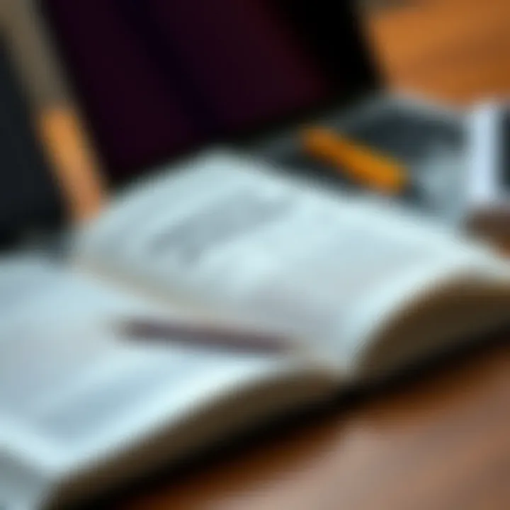 Importance of Education An open book next to a laptop illustrating the importance of education in real estate.